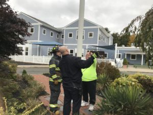 Firefighters and working on flagpole